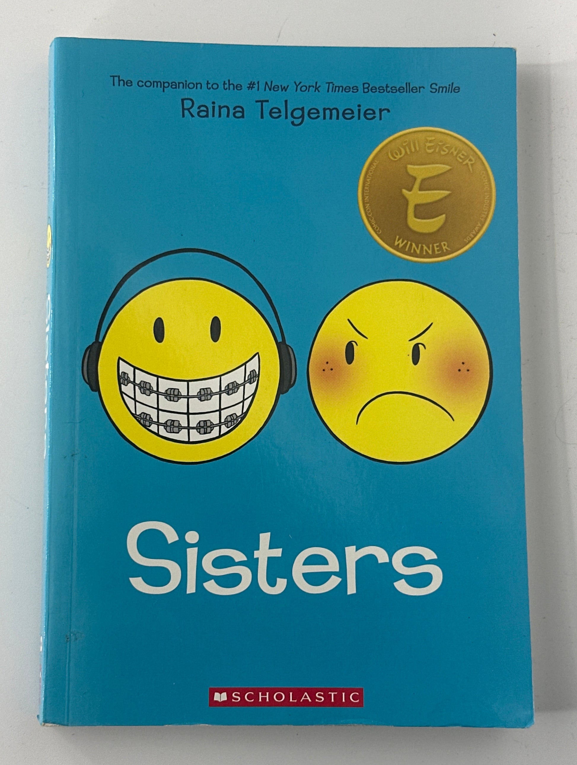 Raina Telgemeier Sisters: A Graphic Novel front cover used books